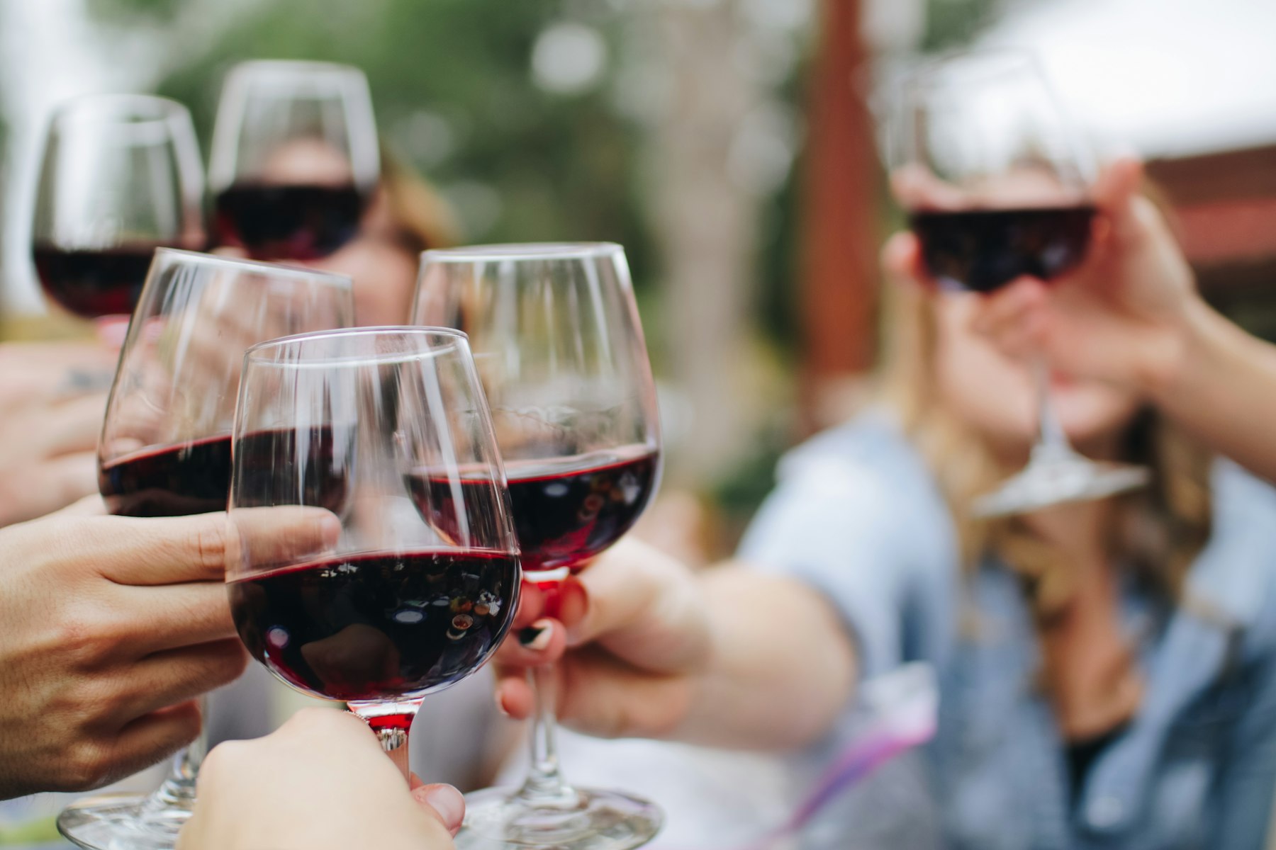 Glasses of the house, raised at the table